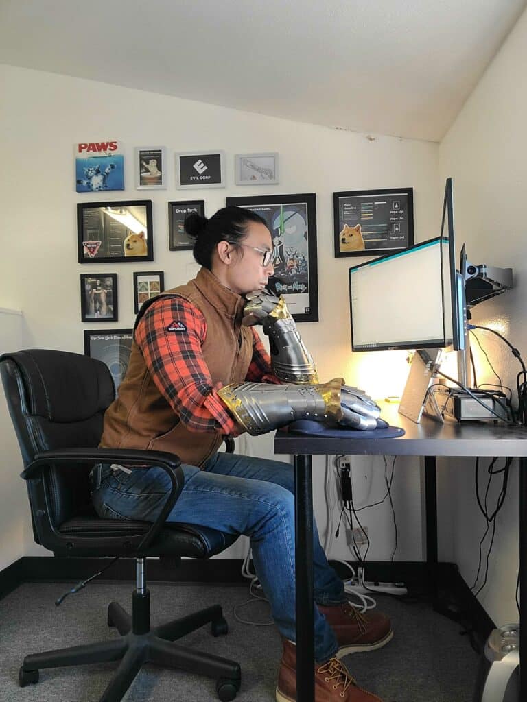 Brian Kuo hard at work sporting medieval gauntlets.